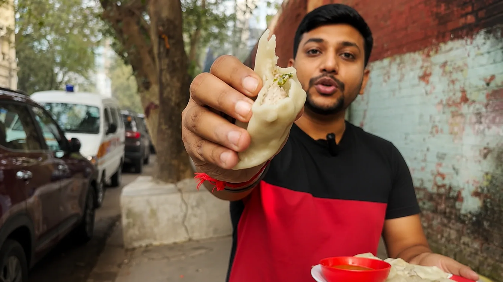 Steamed chicken momos with chutney served in Jadavpur, Kolkata