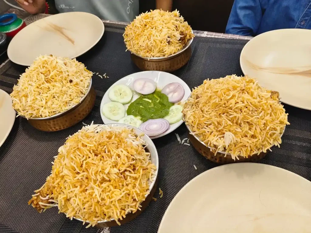 Kolkata mutton biryani served on plate showing rice, mutton and potato